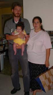 Bryant, Tonia, and Katie pose for the camera in Dad's much emptier house.