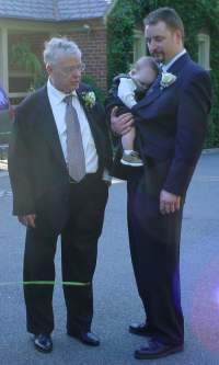 Dad, Lal, and Aiden talk as the newlyweds prepare to drive off...