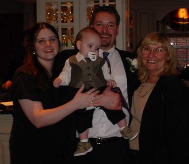 Patsy poses with Lal and his family.