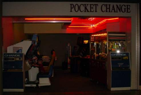 A videogame arcade with a sign that says POCKET CHANGE.