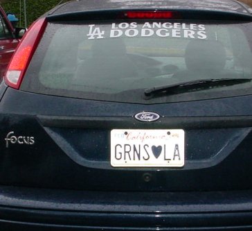 Dodgers fan with "Greens love LA" license plate.