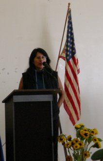 Magali in front of an American flag.