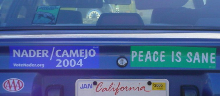 California license plate and a blue and a green sticker.