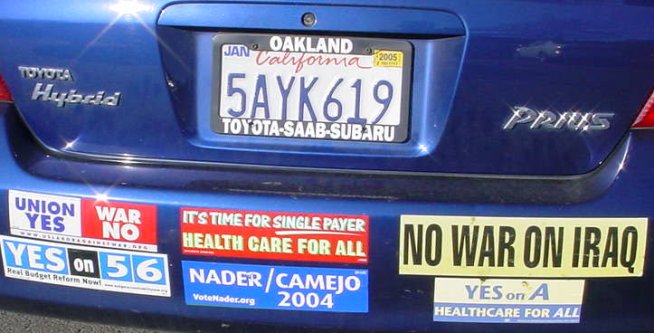 Car rear end with stickers like "NO WAR IN IRAQ".