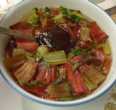 Adding spices to the previously cooked again soup.