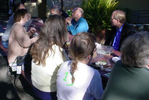 A lot of other greens eating at the other end of the same table.