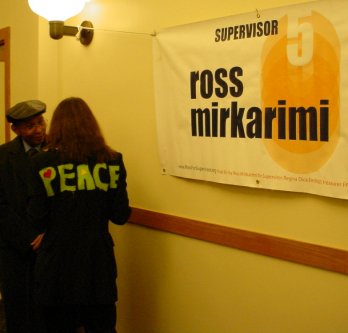 Woman with PEACE jacket with Ross banner.