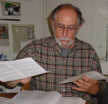 Mike works on the mailing.