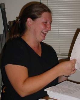 Sara works on the mailing.