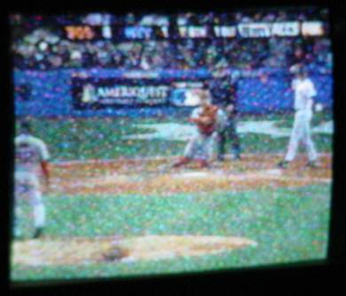 Baseball game (Red Sox vs. Yankees) on TV.