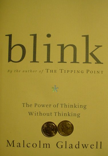 A pair of dimes sits on the cover of a book near the bottom of the page.