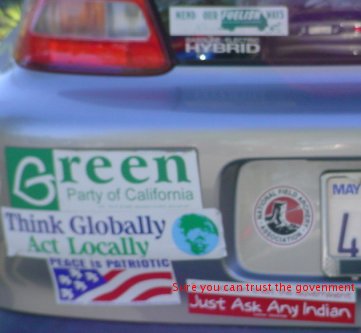 A car bumper with stickers like "Sure you can trust the government. Ask any indian." on it.