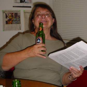 Dana uses beer to make working on the mailing party more fun.