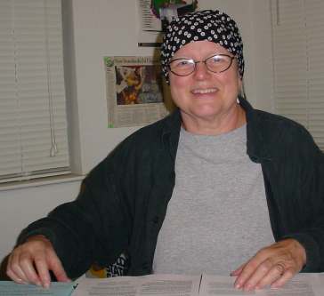 Joan works on the mailing.