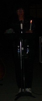 Woman behind the microphone.