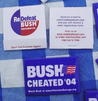 A Bush Cheated '04 button and a pair of similarly merchandised condoms.