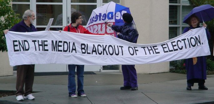 Banner that reads "END THE MEDIA BLACKOUT OF THE ELECTION".