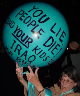 A Helium baloon with "YOU LIE PEOPLE DIE SEND YOUR KIDS TO IRAQ MR. BUSH" on it.