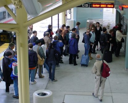 Many people in line to buy BART tickets.