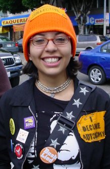 Woman with lots of orange decorations.