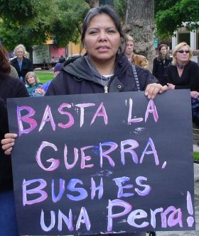 BASTA LA GUERRA says the sign.