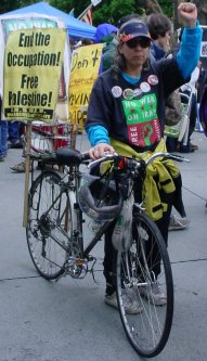 Woman with bicycle who is a total visual statement.