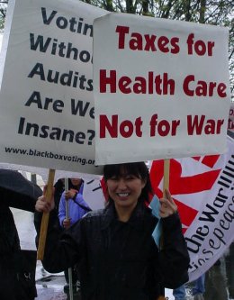 Woman carrying two signs.