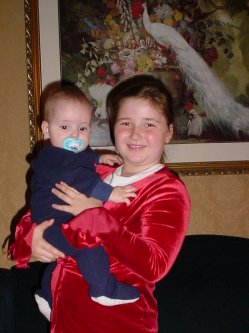 Grace holds her cousin.