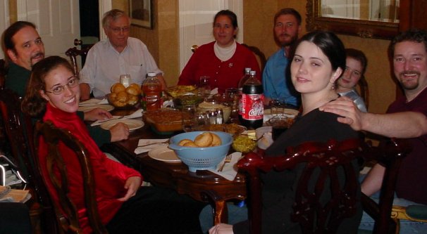 The family sits down to eat.