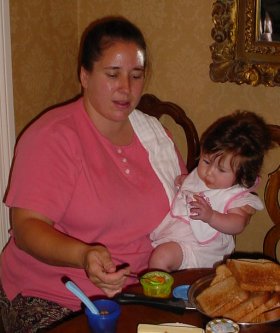 My sister feeds her daughter.