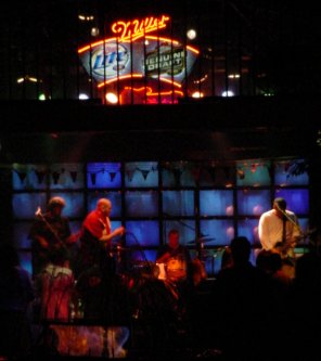 Band plays in cool looking bar.